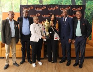 Accompanied by representatives of the South African Football Association, Banyana Banyana assistant coach Simphiwe Dludlu (third from left) and Matshepo Majola, the Chief Marketing Officer of the Clinix Health Group (third from right), hold aloft the impressive trophy that the winner's of the women's division of the Clinix Stix Morewa Soccer Challenge will receive.