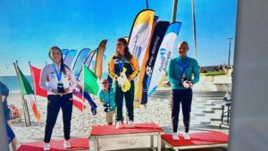 Clad in her South African tracksuit, Holly Smith is all smiles as she is recognised as the junior girls' world champion at the K1 Ocean Paddling World Championships.
