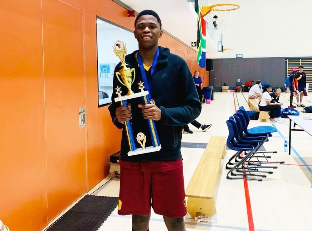 Lutho Tukayi holding the African Grassroot Hoops Youth Classic Basketball Tournament title in 2024. Photo. Supplied.