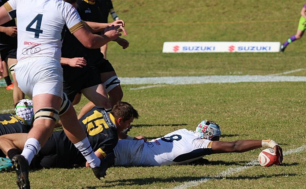 St Charles number eight, Raphael Ajibade, stretches across the try line for the first of his two tries against St David's Marist Inanda. Photo: St Charles College on Facebook.